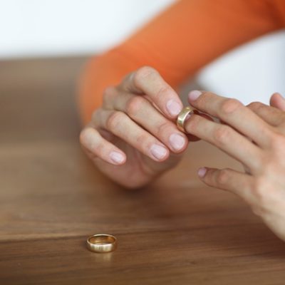 Woman taking ring off finger