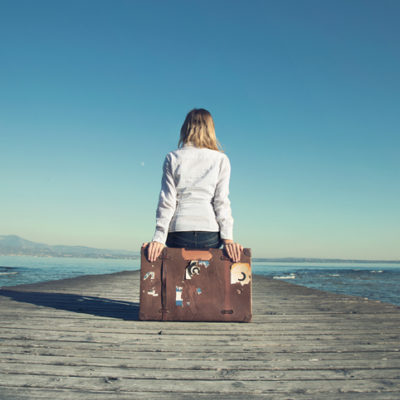 <img src="Woman on Suitcase with Pier" alt="Woman contemplating leaving"/>