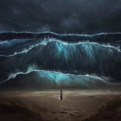 Woman on the beach facing tidal waves