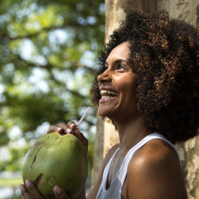 Woman drinking coconut water