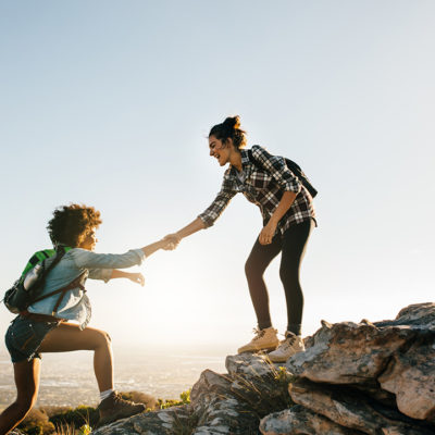 Two women helping each other