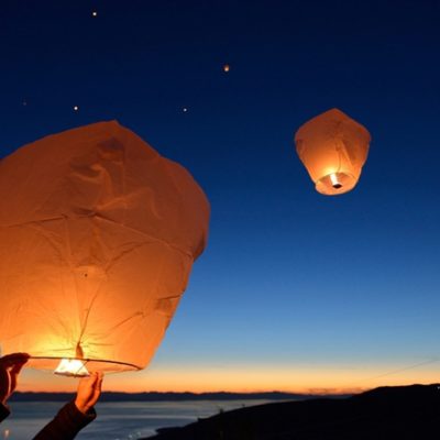 paper lanterns against dark sky