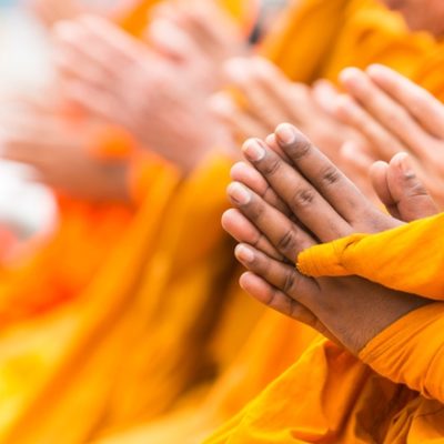 Monks with hands in namaste