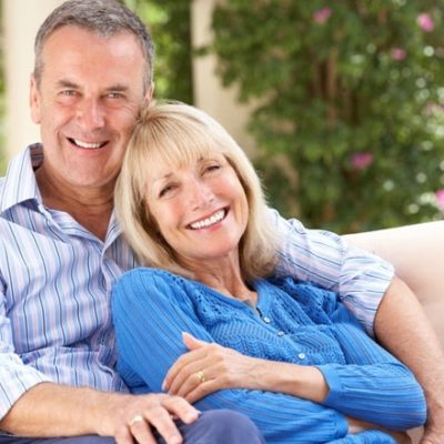 senior couple relaxing on couch