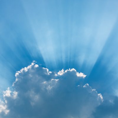 blue sky and clouds with silver linings of light to symbolize pandemic silver linings