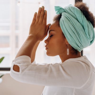 Woman practices yogic breathing to lower inflammation