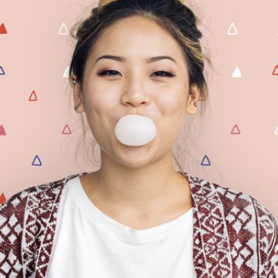 A woman blowing gum illustrates the concept of embracing circles for emotional sustainability