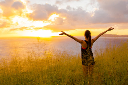 Woman Reaching Her Arms To The Sky