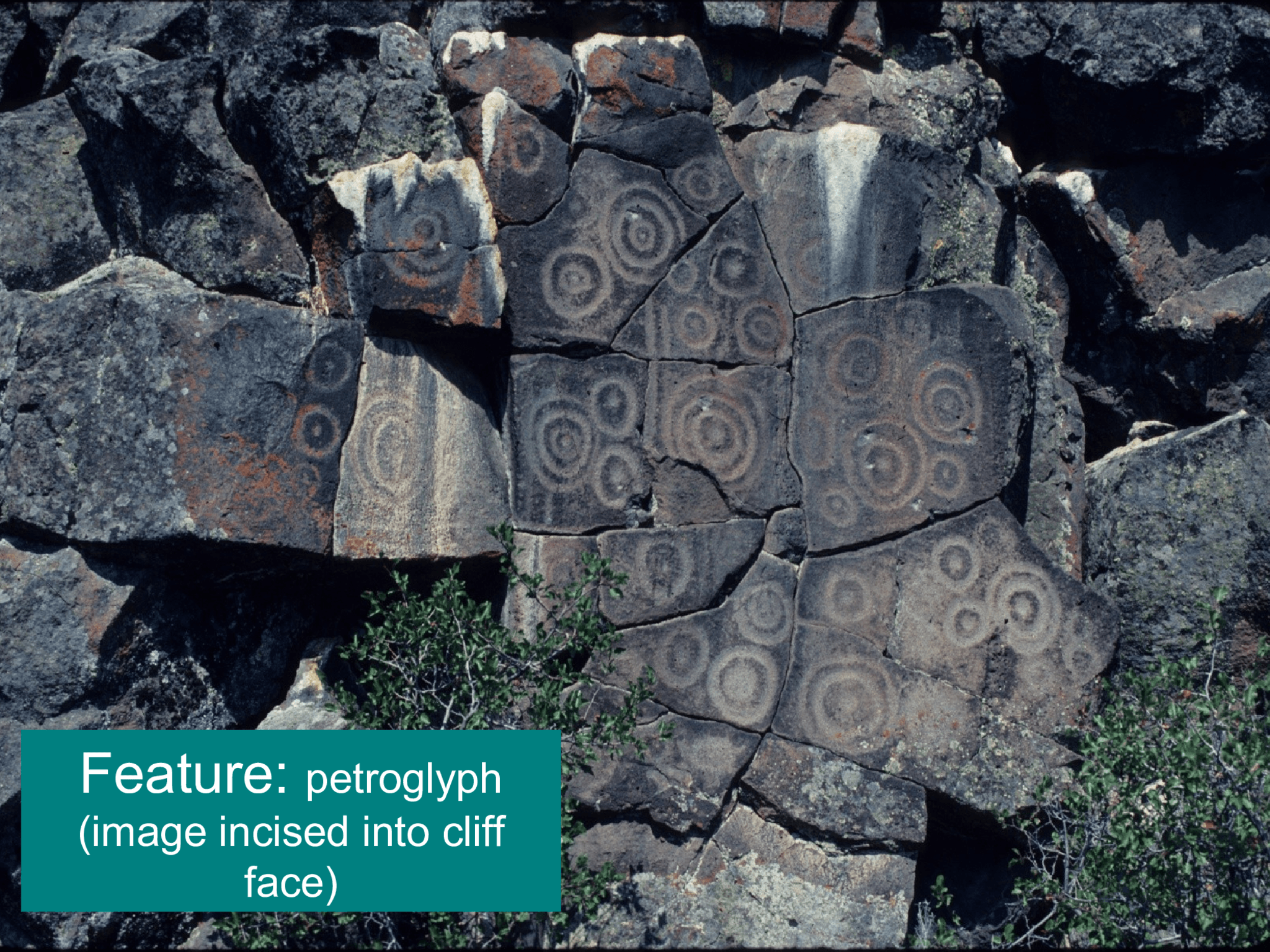 Feature:  petroglyph  (image incised into cliff  face)