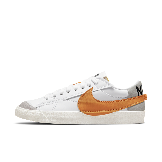 White nikes deals with orange swoosh