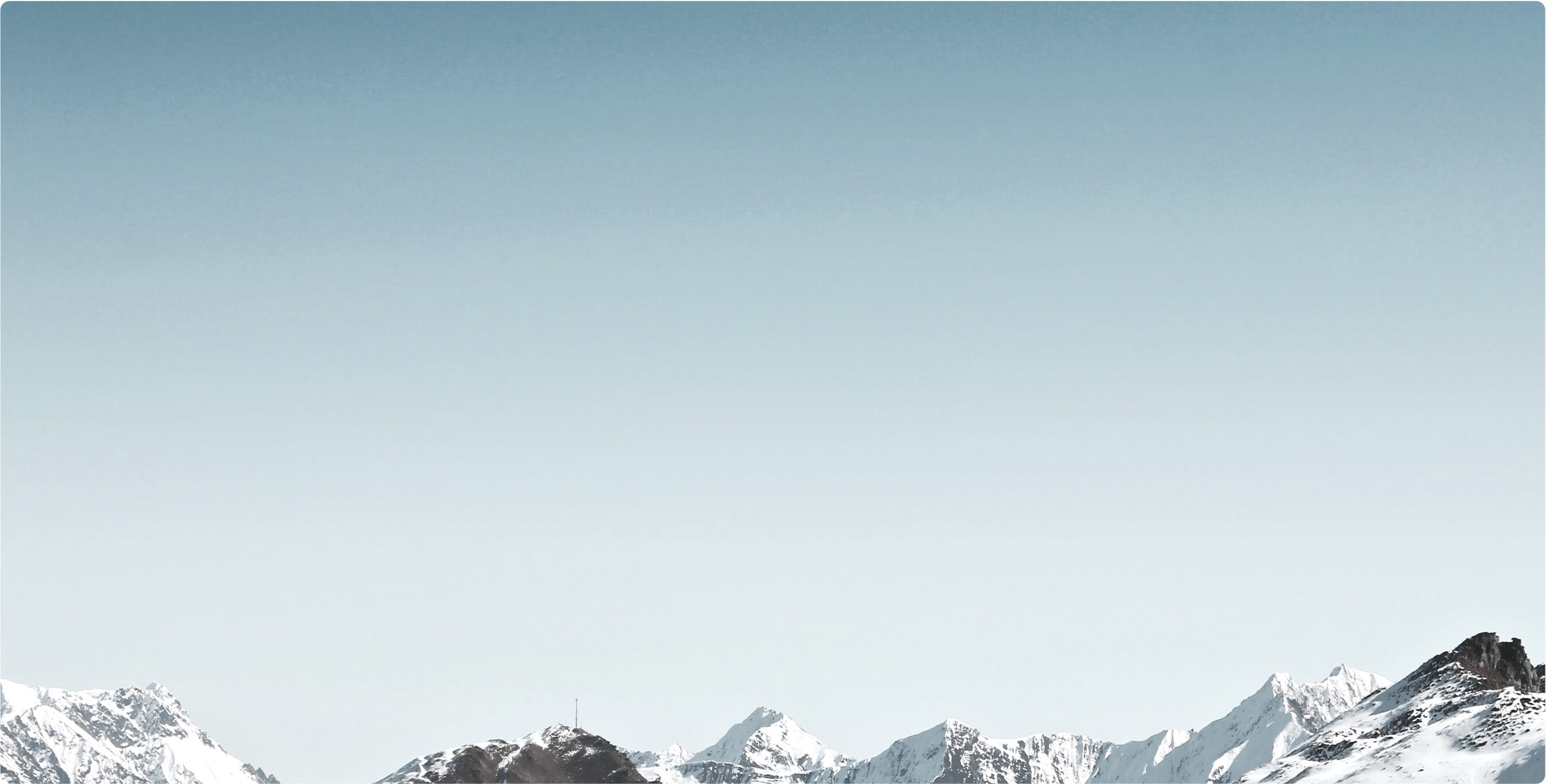 Blue sky and mountains covered with snow