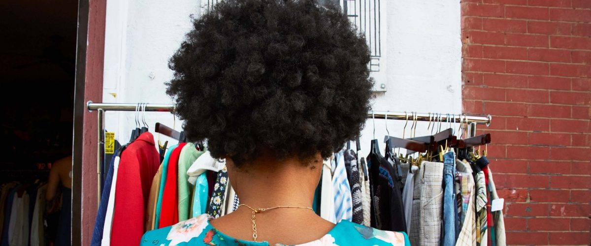 Woman shopping for vintage clothes