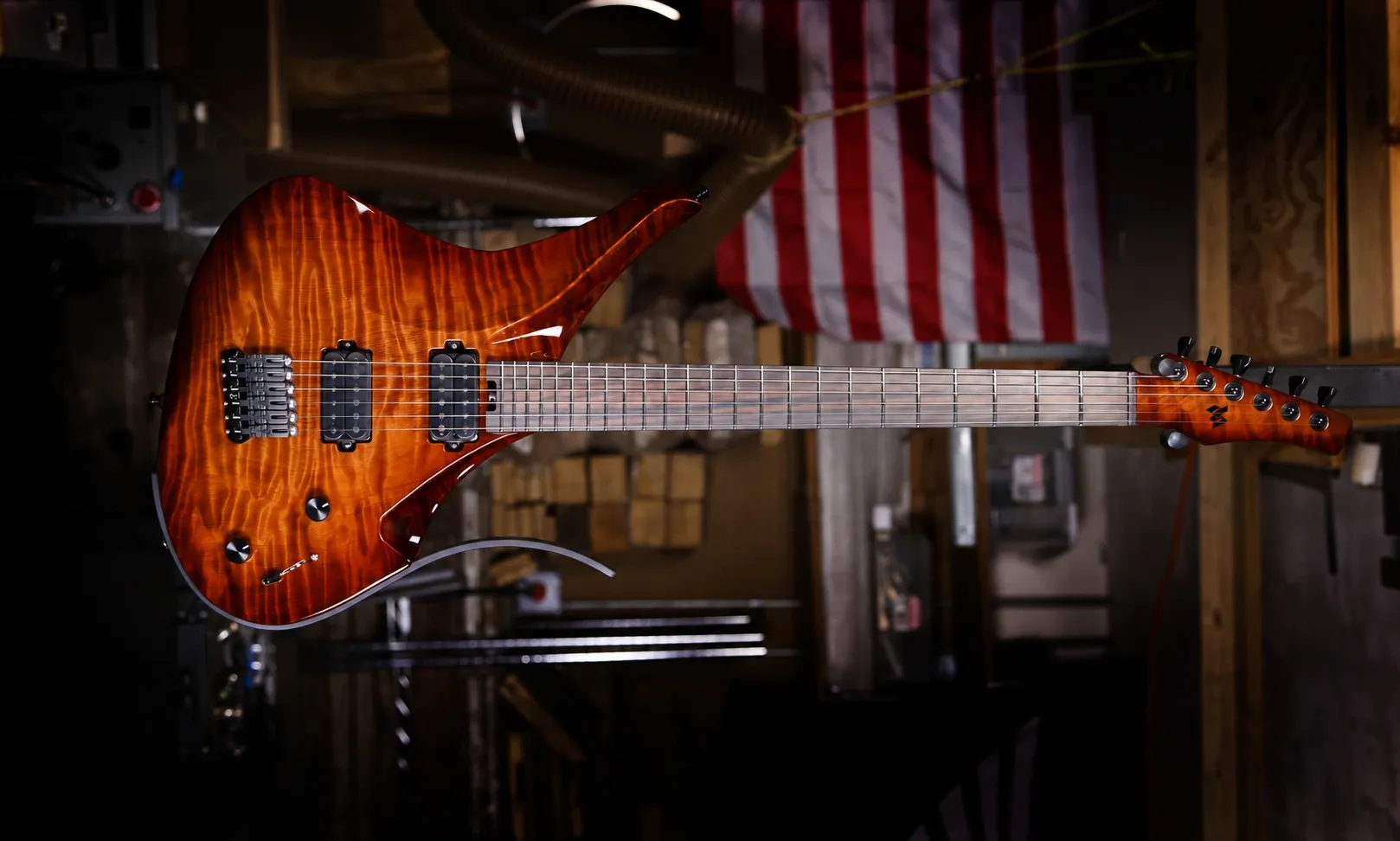 Orange figured maple Virtus guitar in the workshop
