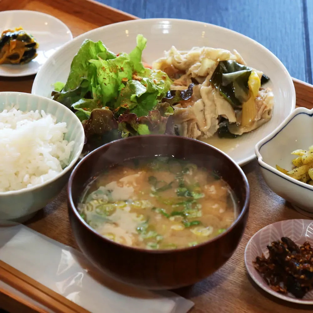 A bowl of the shiitake, kelp, dried sardine, and bonito miso soup served with a set meal at TAKEHISA's own store
