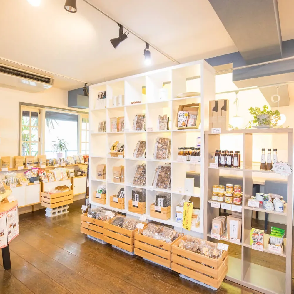 Inside TAKEHISA's own shiitake store in Chikugo, with packaged dried shiitake on the shelves