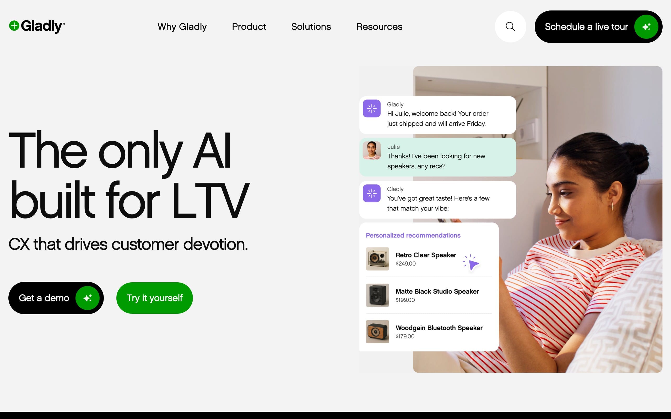 Gladly homepage hero section with the headline The only AI built for LTV, buttons to get a demo or try it yourself, and a customer messaging and product recommendation mockup beside a woman using a phone