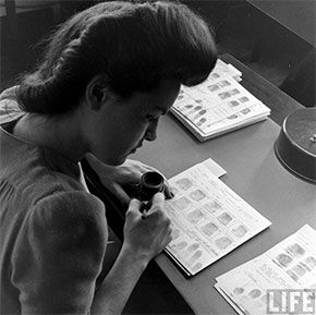 A photo of a worker at the FBIs former fingerprint warehouse. Thousands of women worked at this warehouse to look up and file fingerprints prior to the digital age.