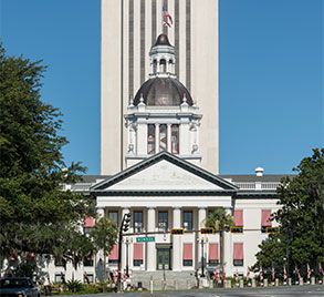 The New Capitol Building in Tallahassee stands behind the Old Capitol Building.