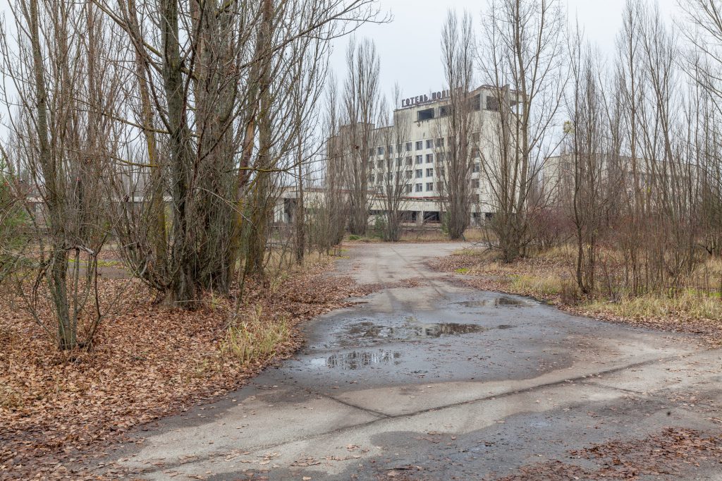 Abandoned buildings in overgrown ghost city Pripyat.