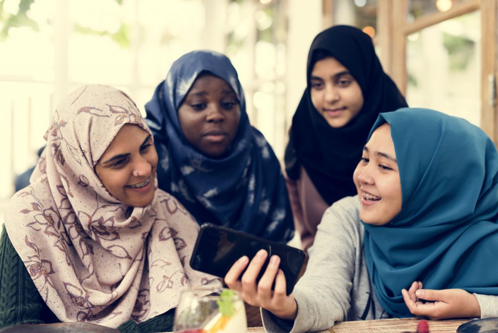 Group of students using mobile phone