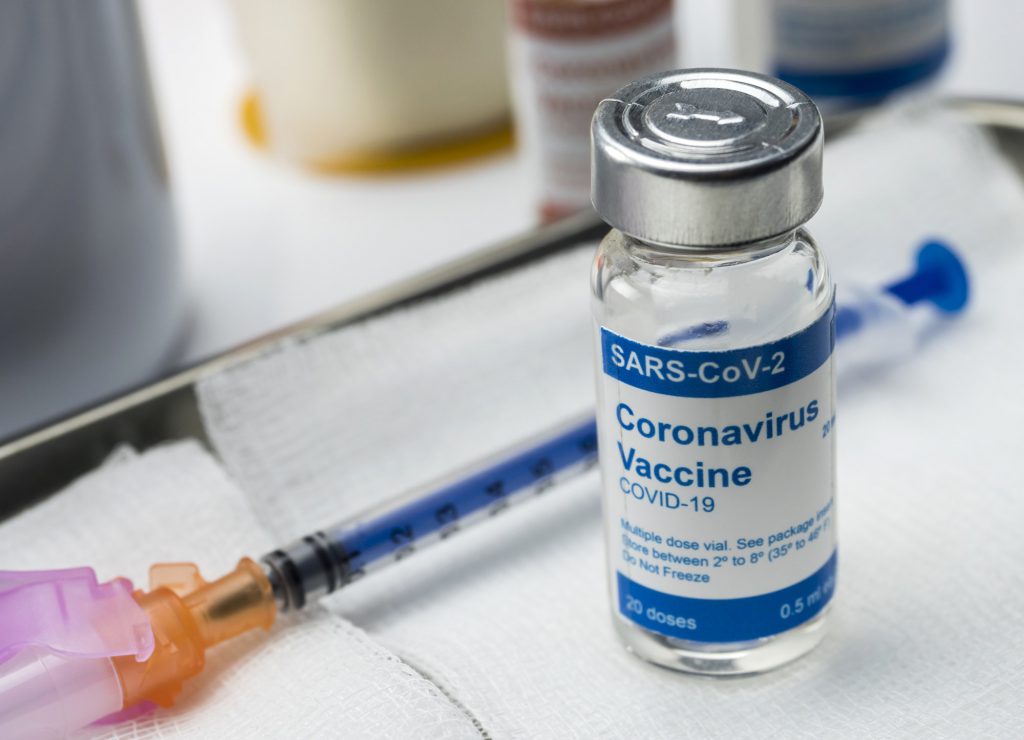 Coronavirus covid-19 experimental vaccine in a laboratory, conceptual image