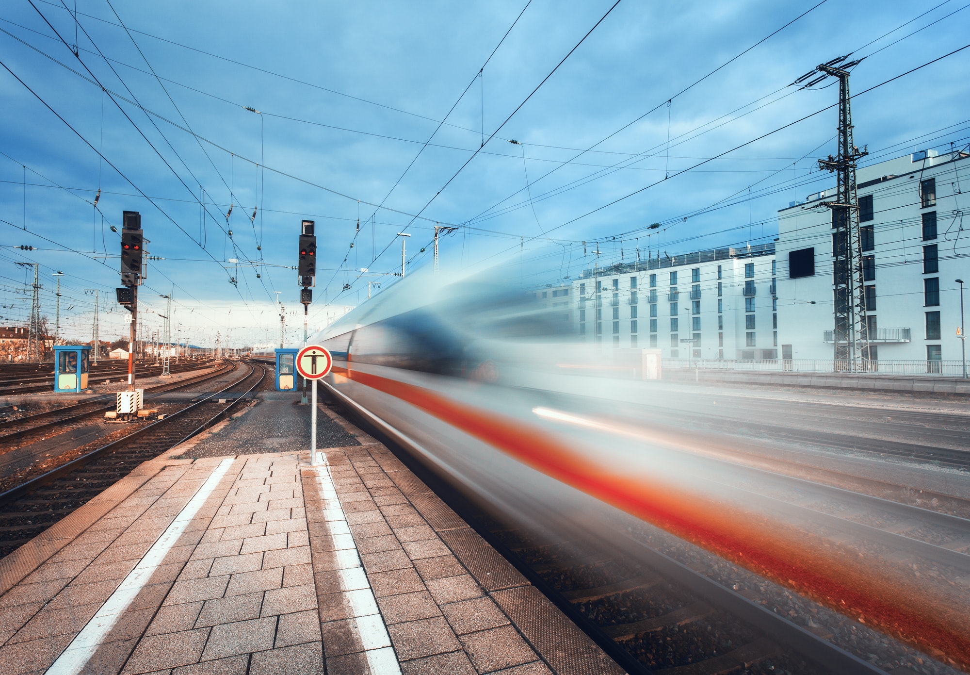 High speed passenger train on railroad track in motion