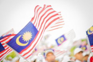 blurry malaysia flags waving on independence day
