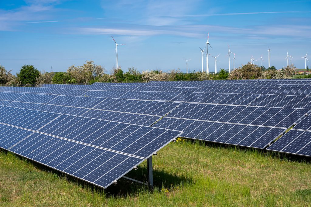 Solar panels with wind turbines