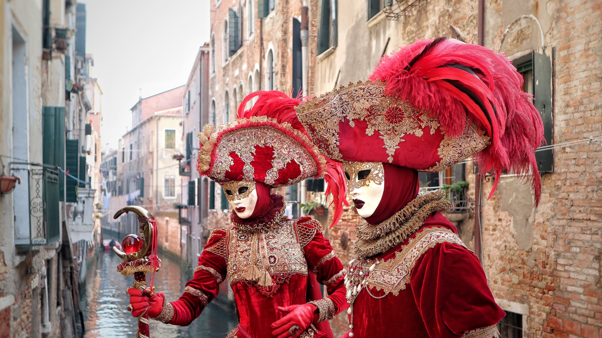 Two women masquerade in Venice