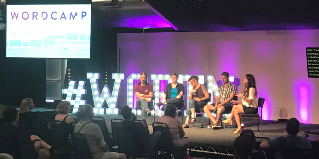 WordCamp US - Image of wordpress speakers on stage at the venue.