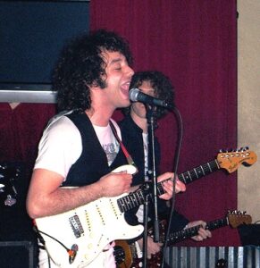 Stroke Front-man Albert Hammond Jr using his white Fender Stratocaster