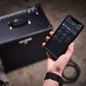 The Katana Bass Tone Studio app on a phone with a Katana bass amp in the background