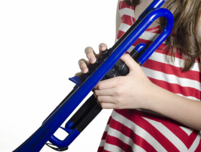 Blue pTrumpet held by a child in a stripy top 