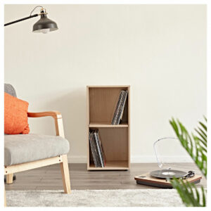 The LP Cabinet by Gear4music in a beech wood effect with a turntable, chair, rug, lamp, and plant in front