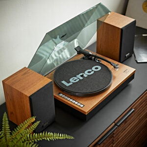 The Lenco LS-300 turntable in a natural wood finish with the lid up