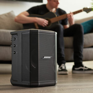 The Bose S1 Pro used by a man playing guitar 