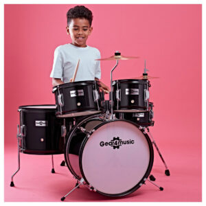 A child playing the Junior 5 Piece Drum Kit by Gear4music