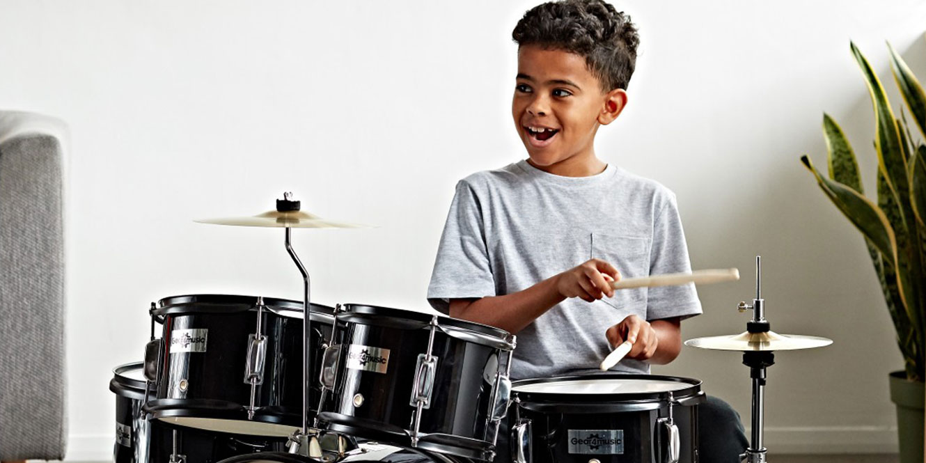 kid playing drums