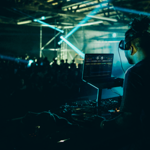 A DJ using DJ software for a live set