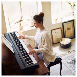 A pianist playing the Yamaha P45 Digital Piano