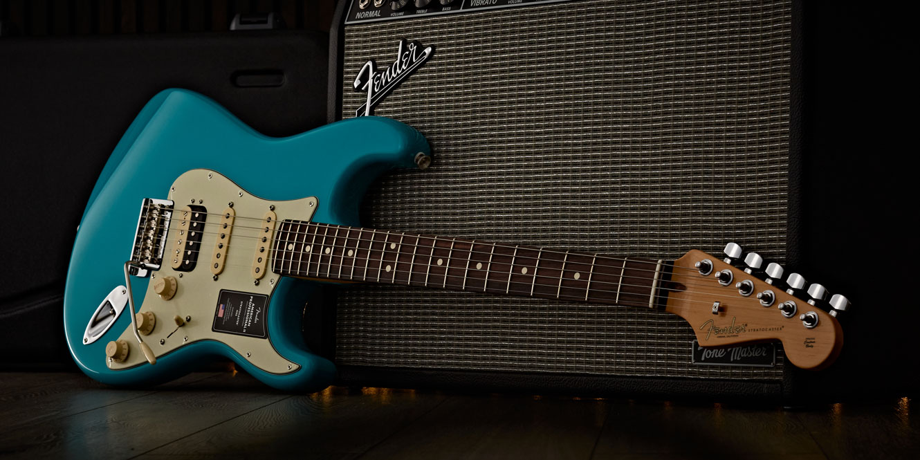 Fender American Pro II Stratocaster alongside a Fender amp