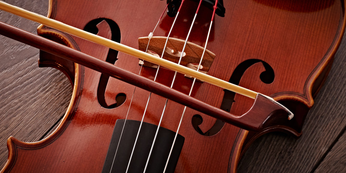 A violin bow on a violin