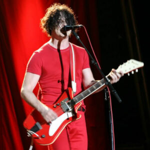 The White Stripes playing his red Valco Airline Res-O-Glass "JB Hutto" guitar on stage 