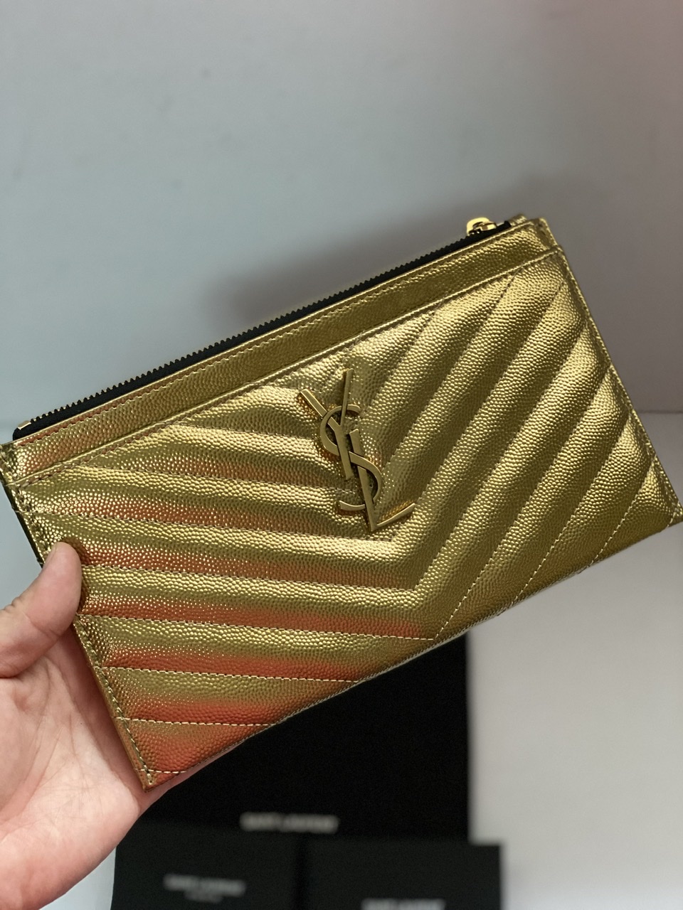 Clutch bag Yves Saint Laurent Gold in Polyester - 30237053