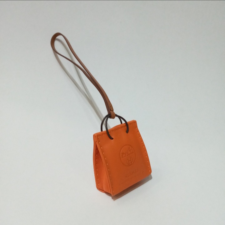 Hermès - Orange Bag Charm