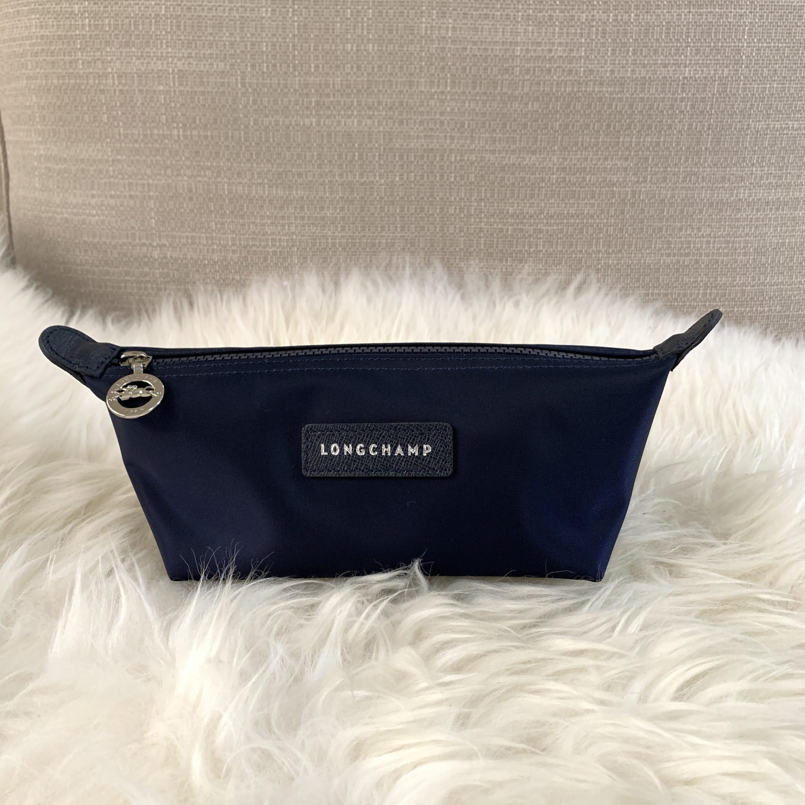 longchamp Le Pliage Neo Pouch in marine, Luxury, Bags & Wallets on Carousell