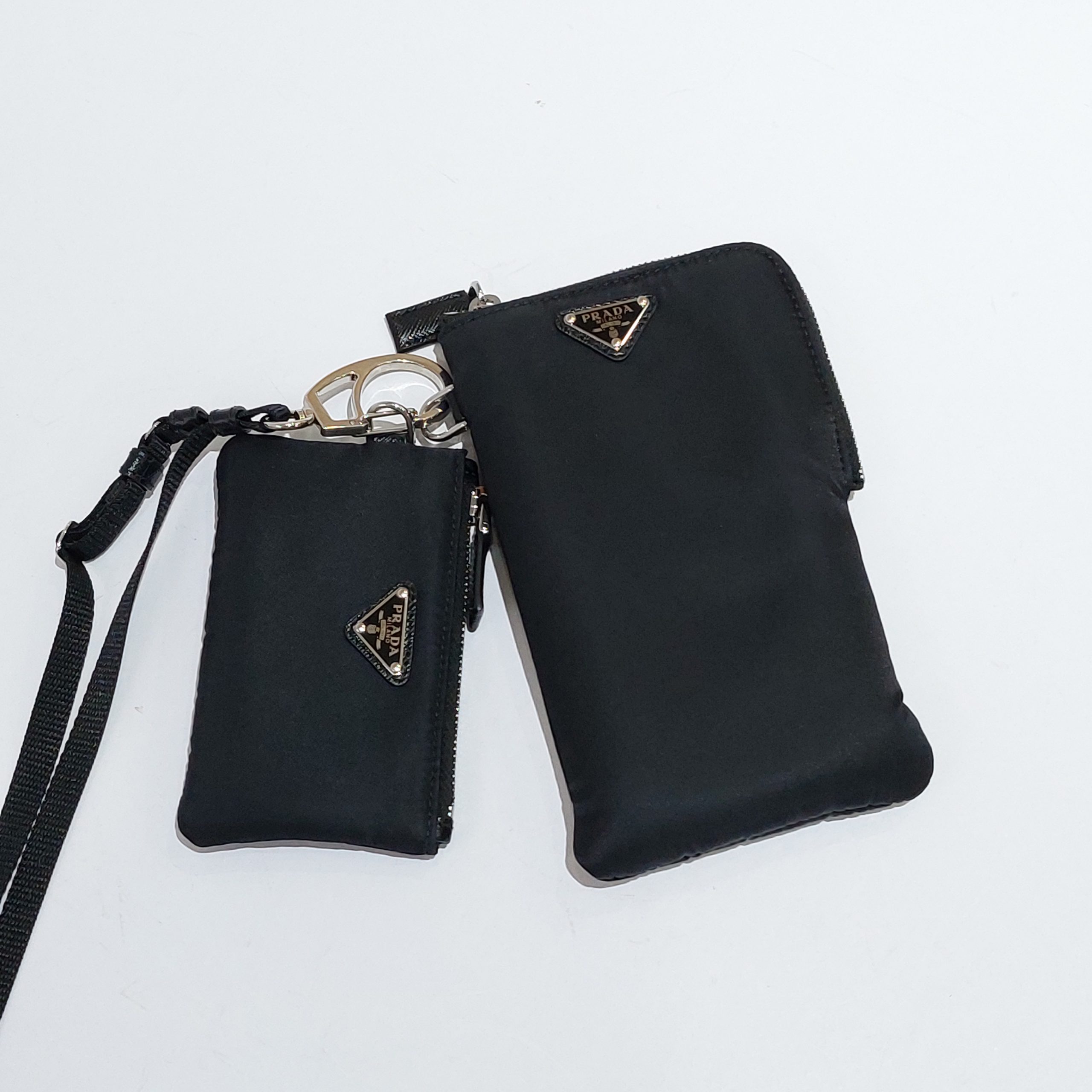 Prada - TWO RE-NYLON POUCHES  HBX - Globally Curated Fashion and Lifestyle  by Hypebeast