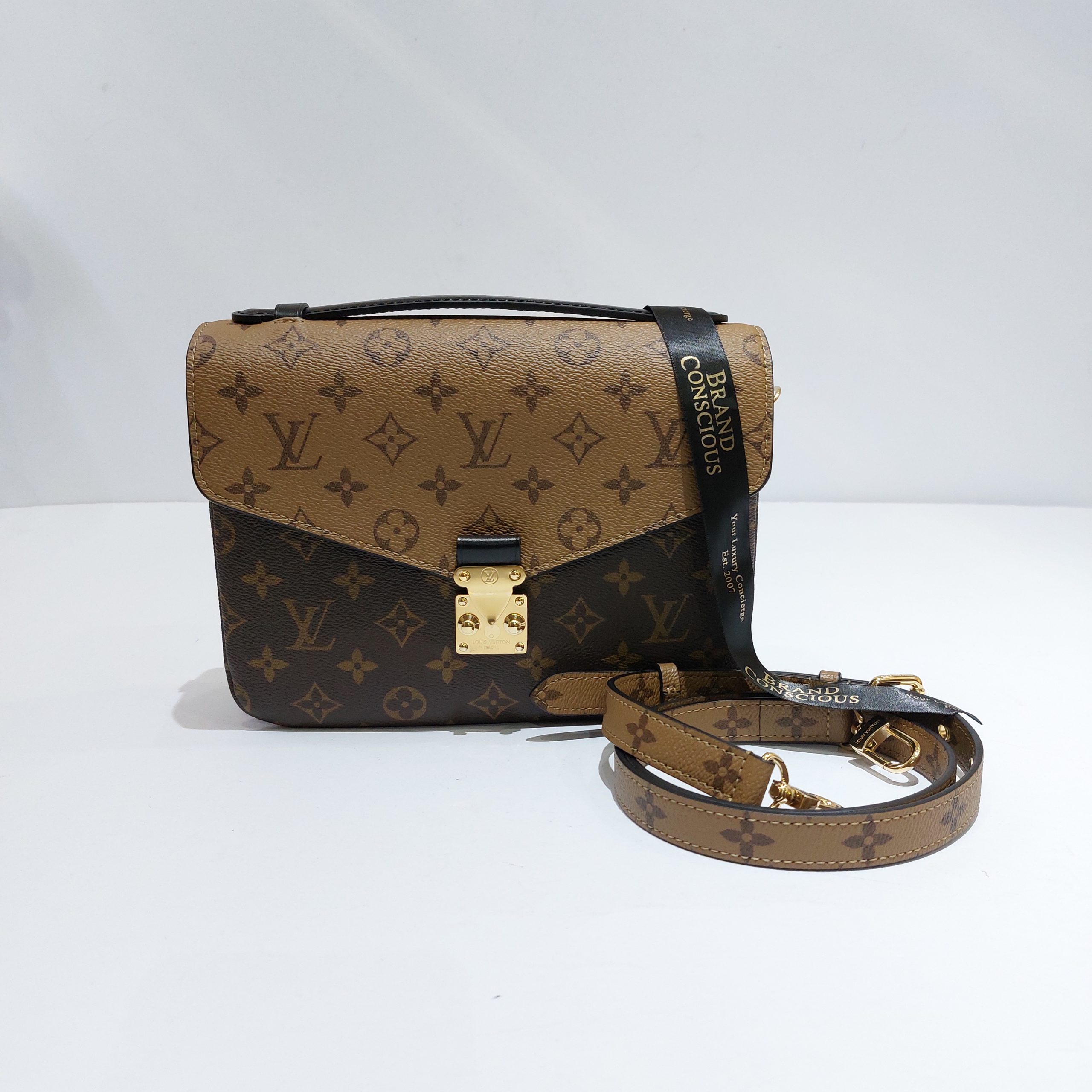 Louis Vuitton Pochette Métis Monogram Reverse Canvas BNEW - BrandConscious  Authentics