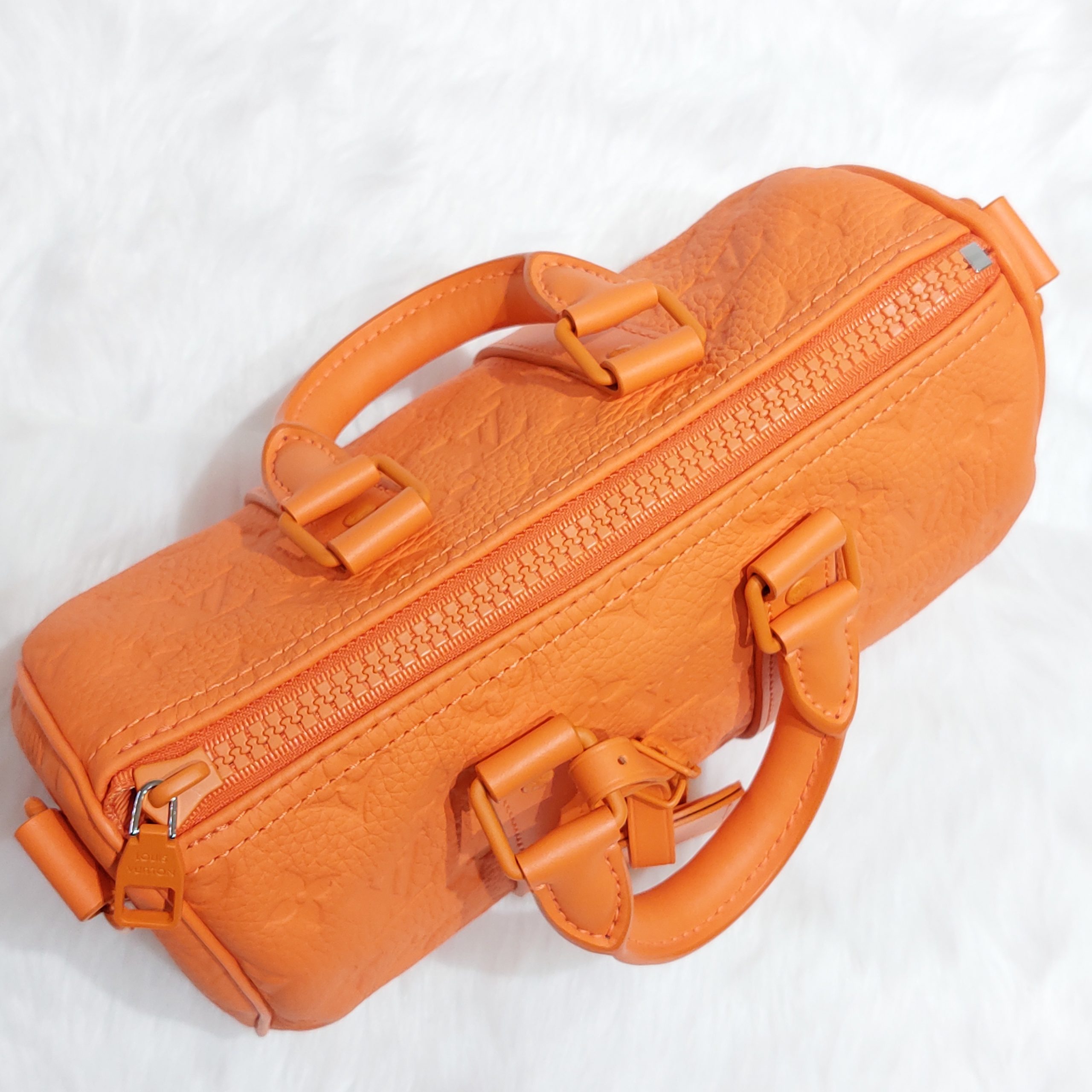 Keepall leather travel bag Louis Vuitton Orange in Leather - 30548885