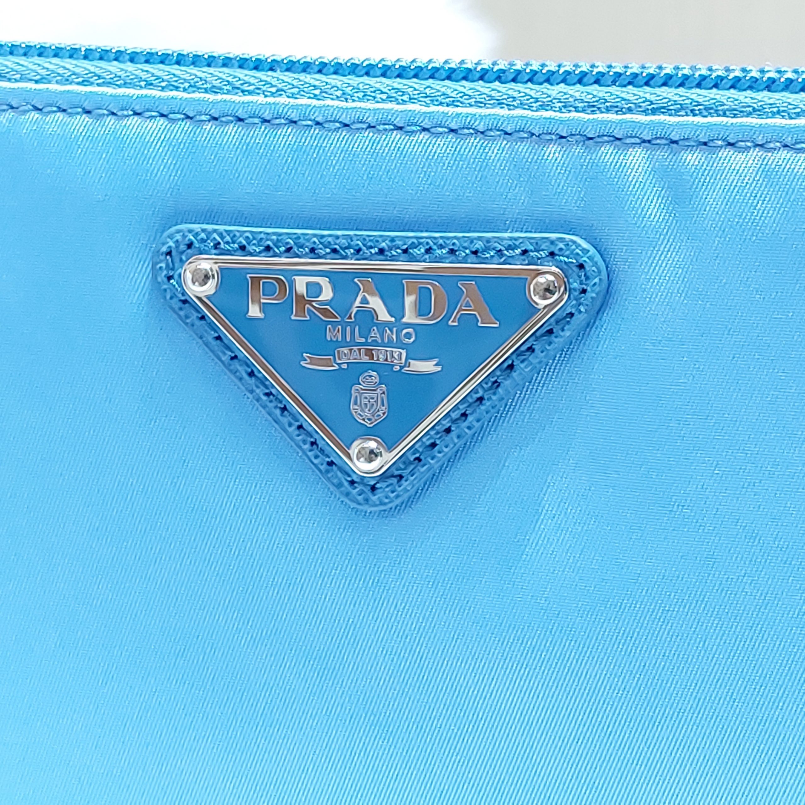 Prada Blue Tessuto Nylon Pouch Wristlet Clutch Silver – Queen Bee of  Beverly Hills